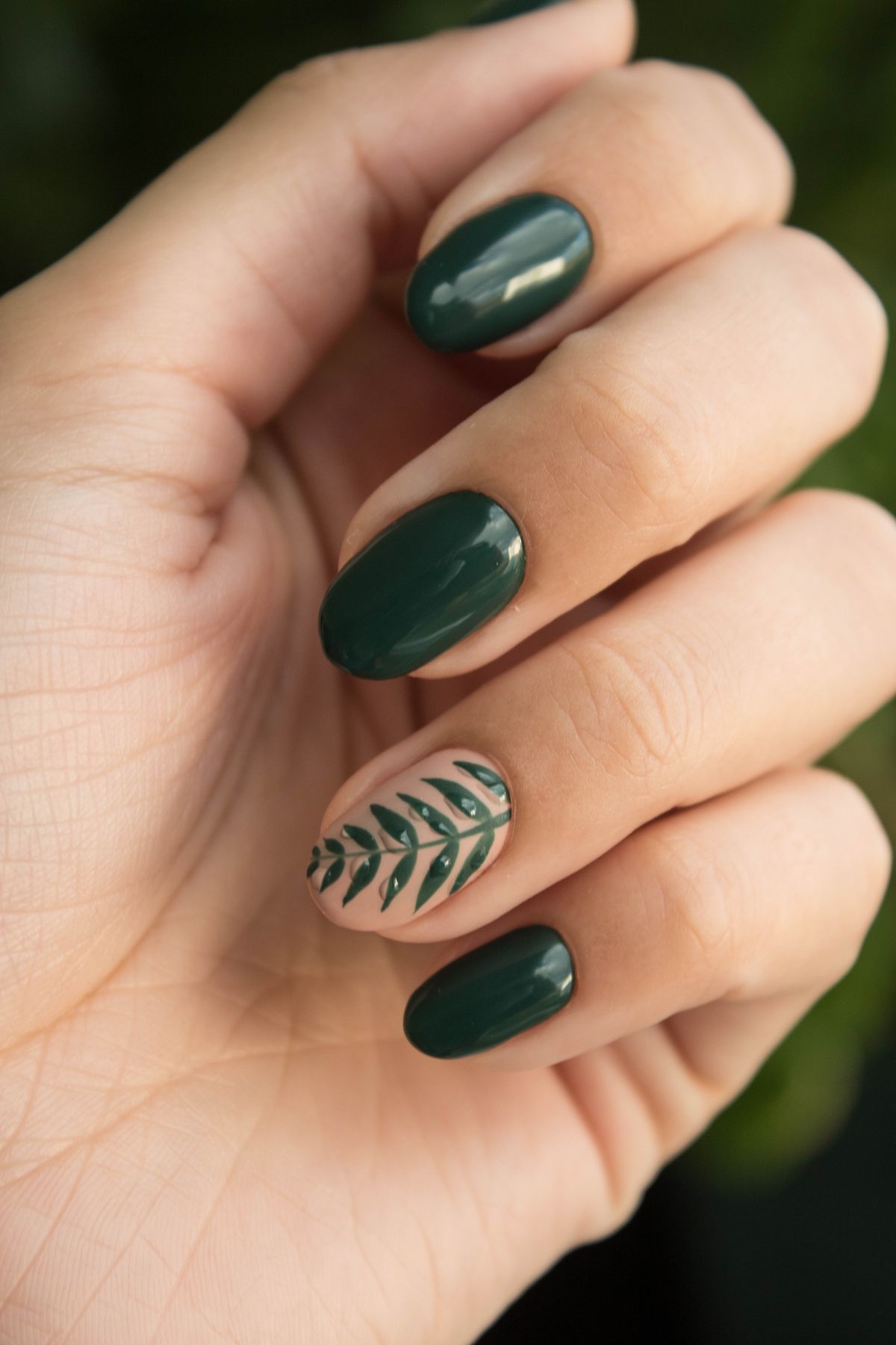 Green nail art with hand-painted detail, Nail Therapy Beauty Boutique